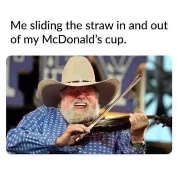 Me sliding the straw in and out of my McDonald’s cup.