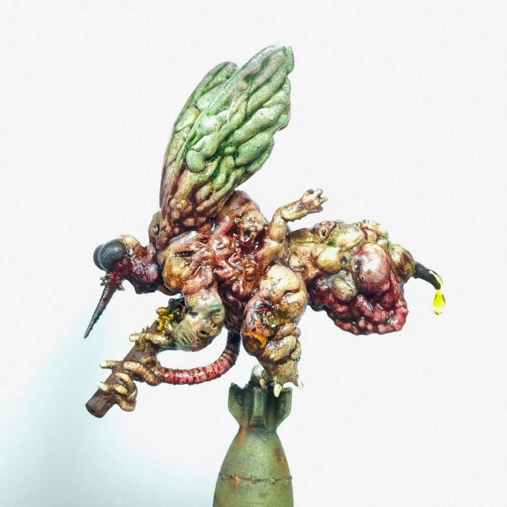 Miniature of a disgusting, bloated fly demon with a gun. 