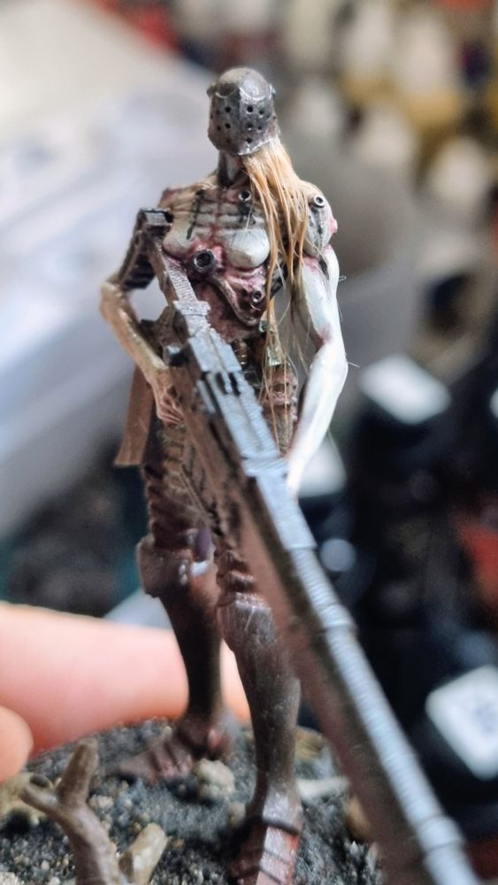 Miniature with real hair applied to it. 