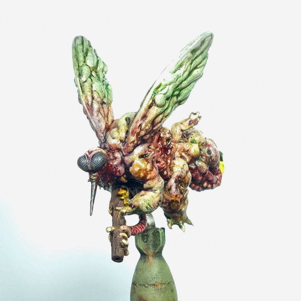 Miniature of a disgusting, bloated fly demon with a gun. 