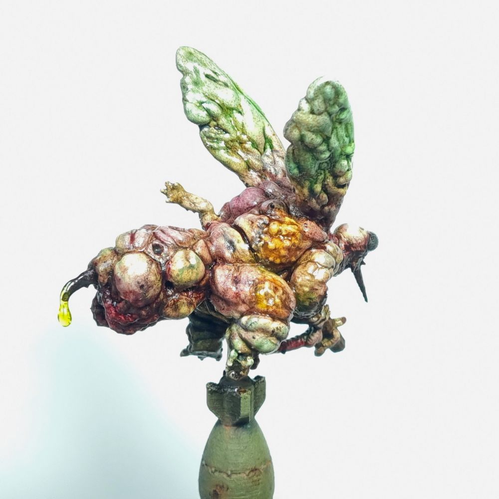 Miniature of a disgusting, bloated fly demon with a gun. 