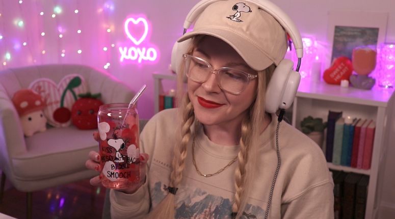Violet in her stream room with snoopy hat and snoopy cup