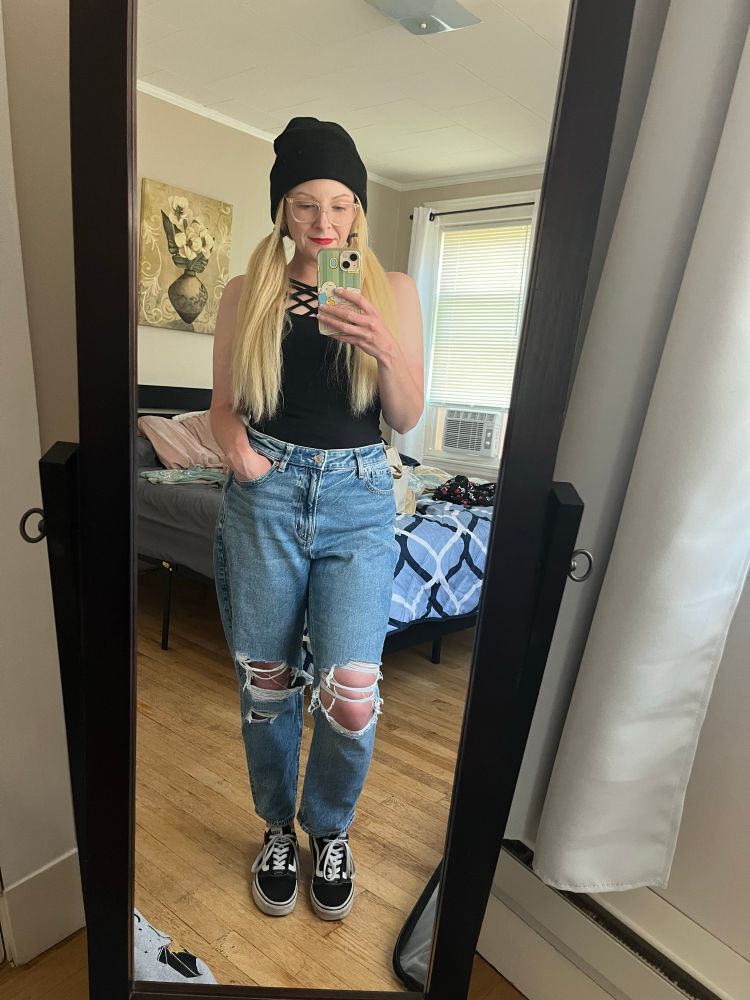 Violet posing in front of a mirror from her trip to Salem 