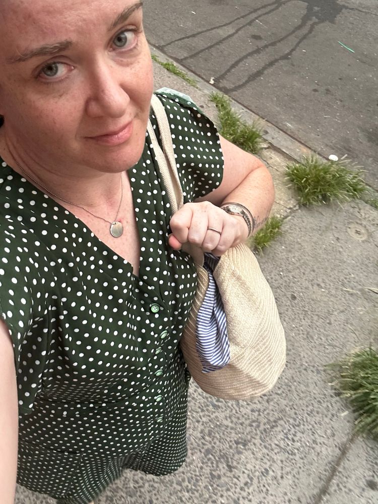 The skeeter in question wearing a green dress with white polka dots and absolutely looking like a preschool teacher