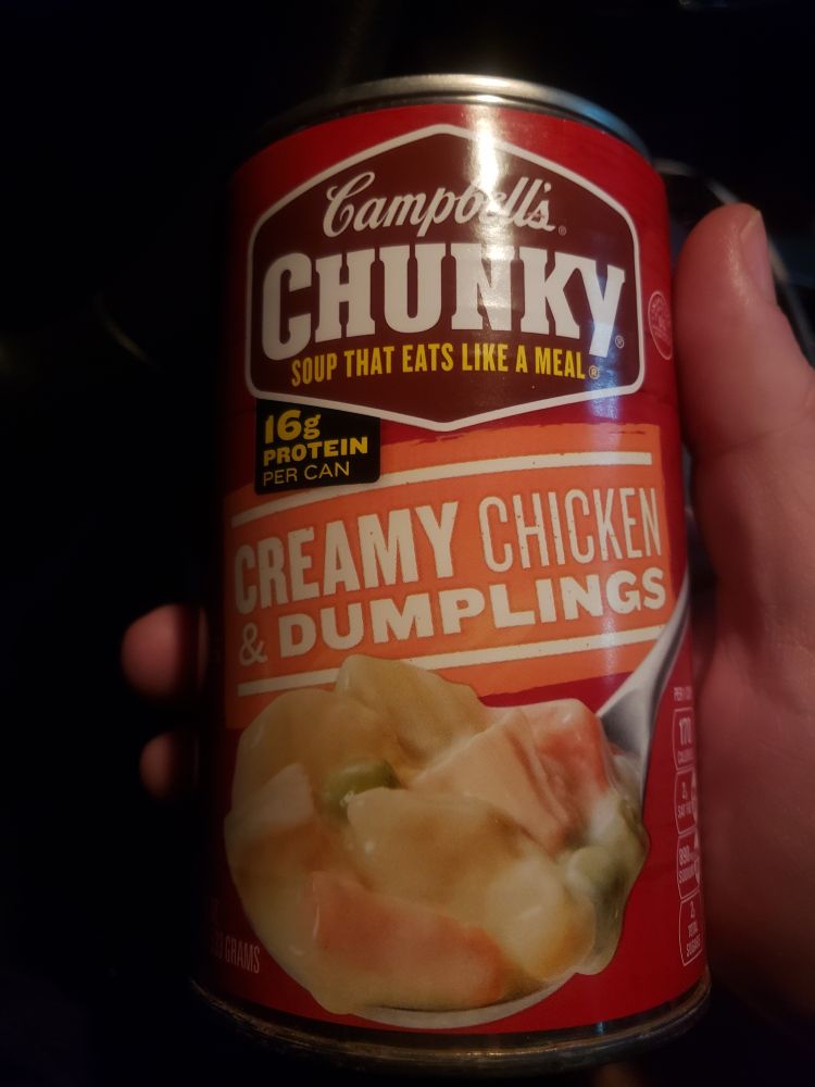 Sosadillatron holding a can of Campbell's Chunky Creamy Chicken and Dumplings soup 