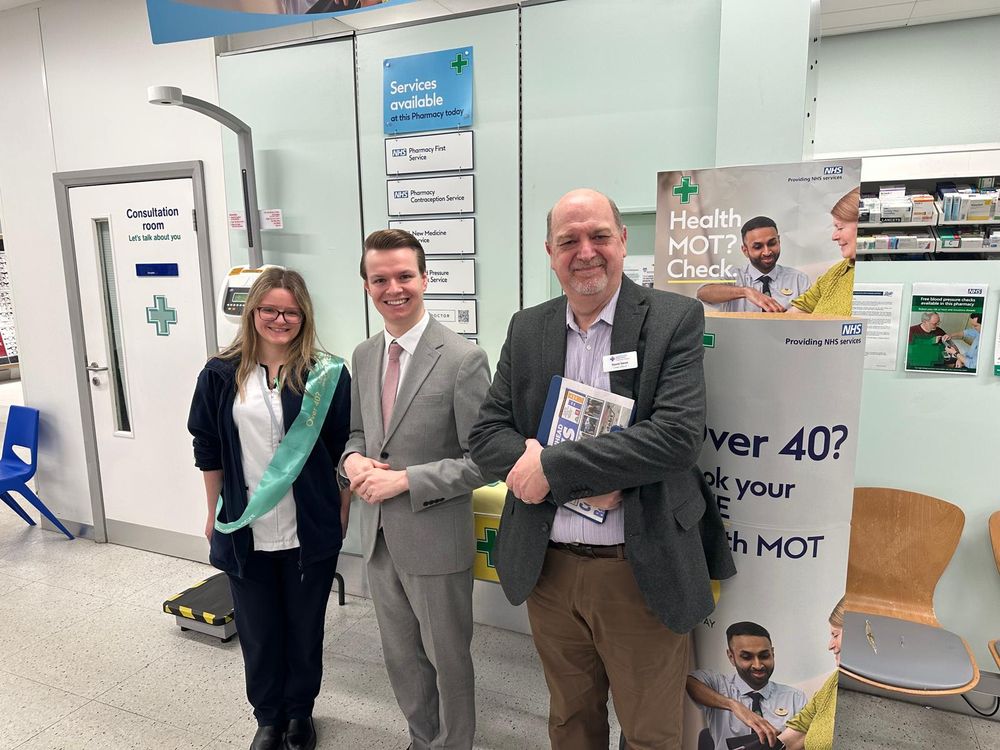 Josh standing with a member of the Boots pharmacy and a member of the McParlands Pharmacy 