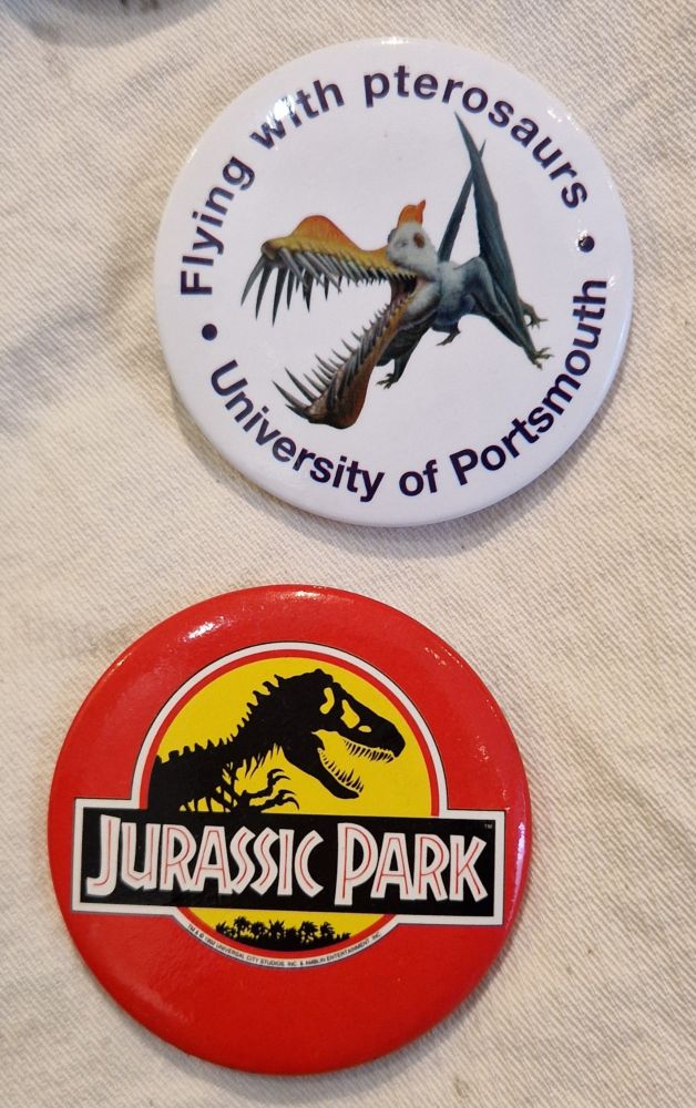 Jurassic Park and pterosaur badges.