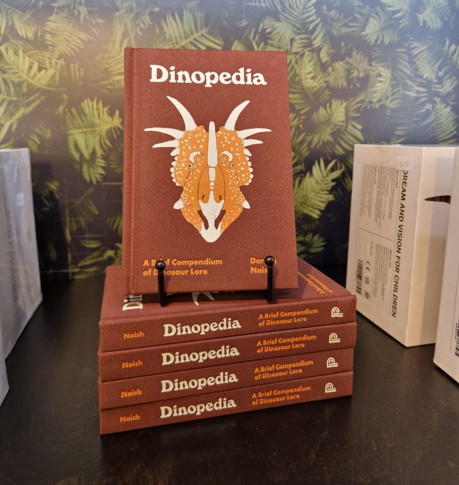 Pile of Dinopedia copies.