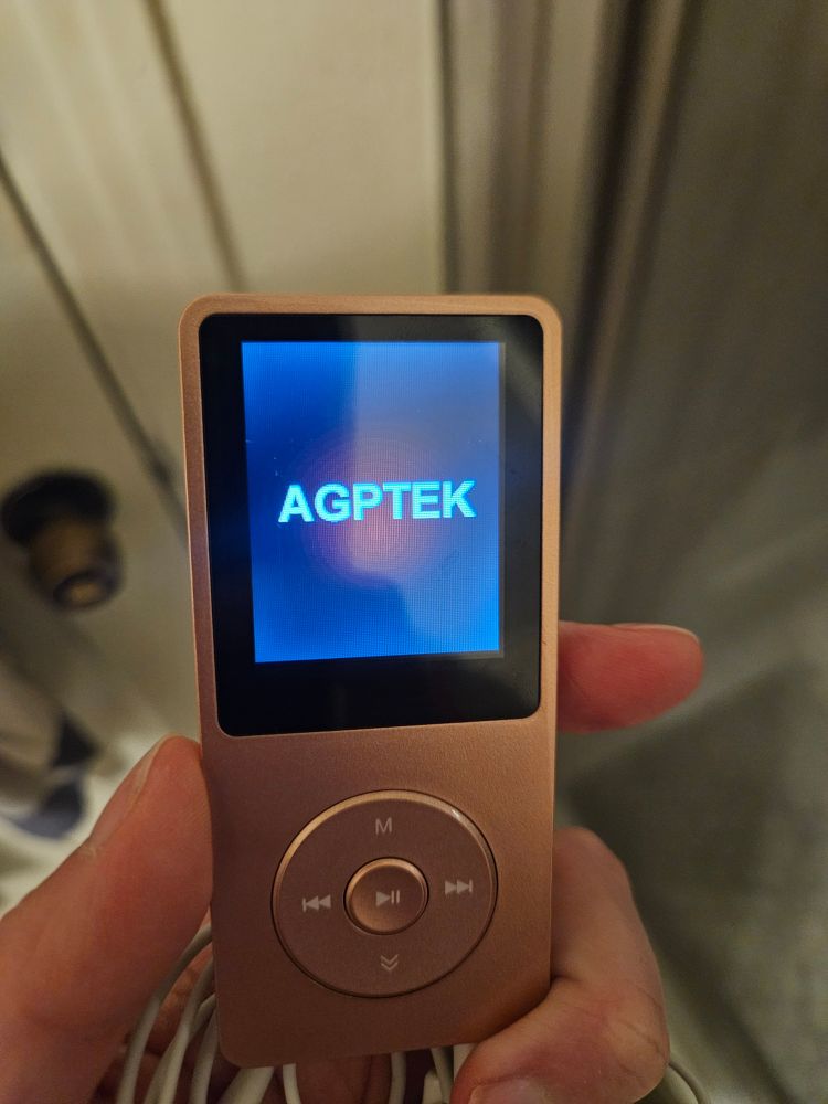 A rose gold mp3 player displays the brand name: "AGPTEK"