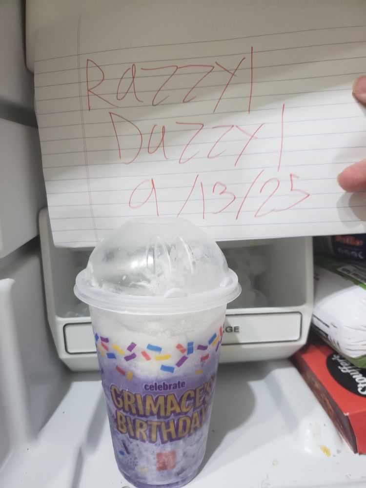 Note reading razzyl dazzyl 9/13/25 above a frozen grimace shake from June 2023 reading celebrate grimaces birthday 