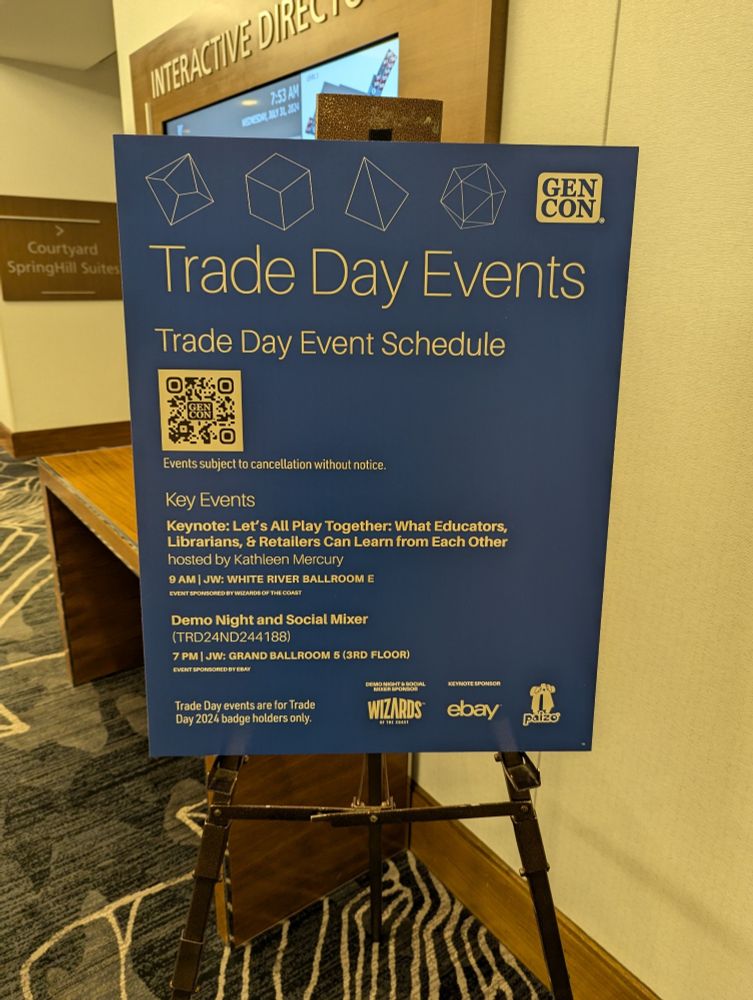 A blue sign titled "Trade Day Events"