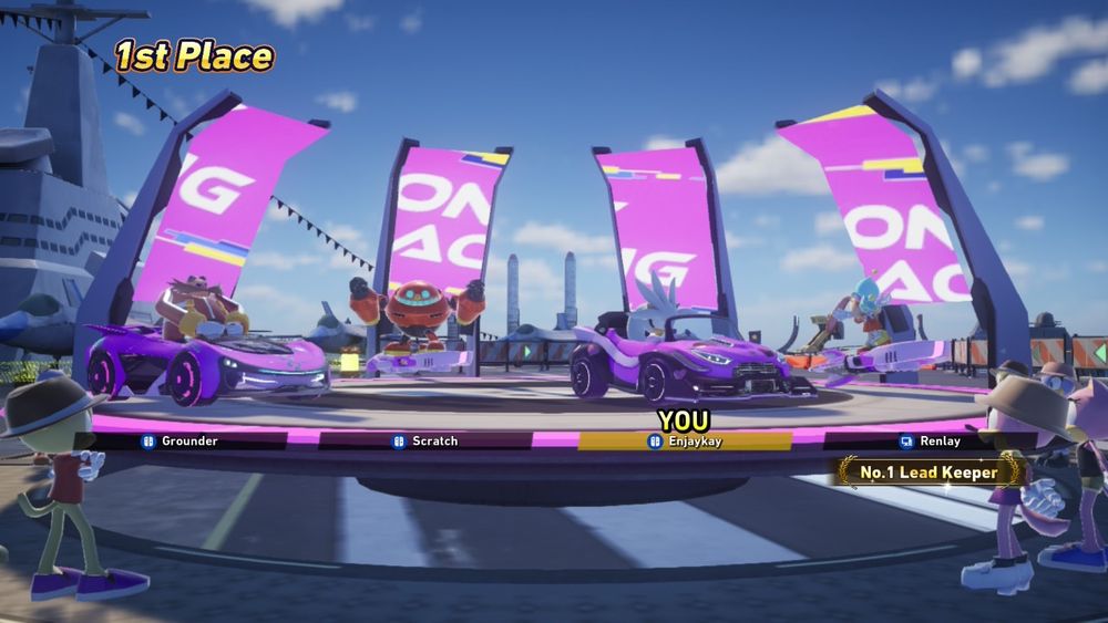 The results screen of a Sonic Racing Crossworlds Festival: The winning team was myself, Enjaykay, playing as Silver the Hedgehog, Renlay playing as Cream the Rabbit and, most relevant, players named Scratch and Grounder playing as Egg Pawn and Eggman respectively.
This is at least a reference to "The Adventures of Sonic The Hedgehog" animated series, but may also reference "Win The Race" a song made using clips and sounds from said show by iteachvader on Youtube.