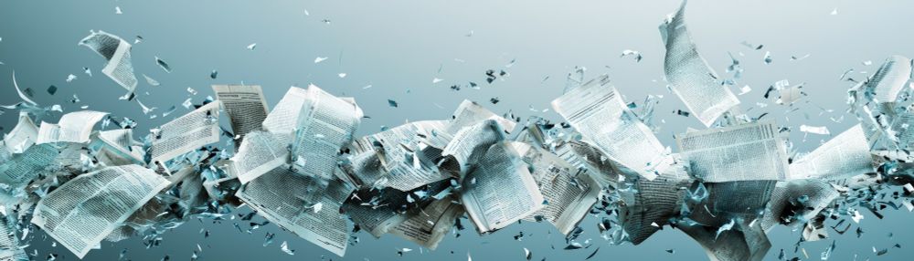papers being torn apart