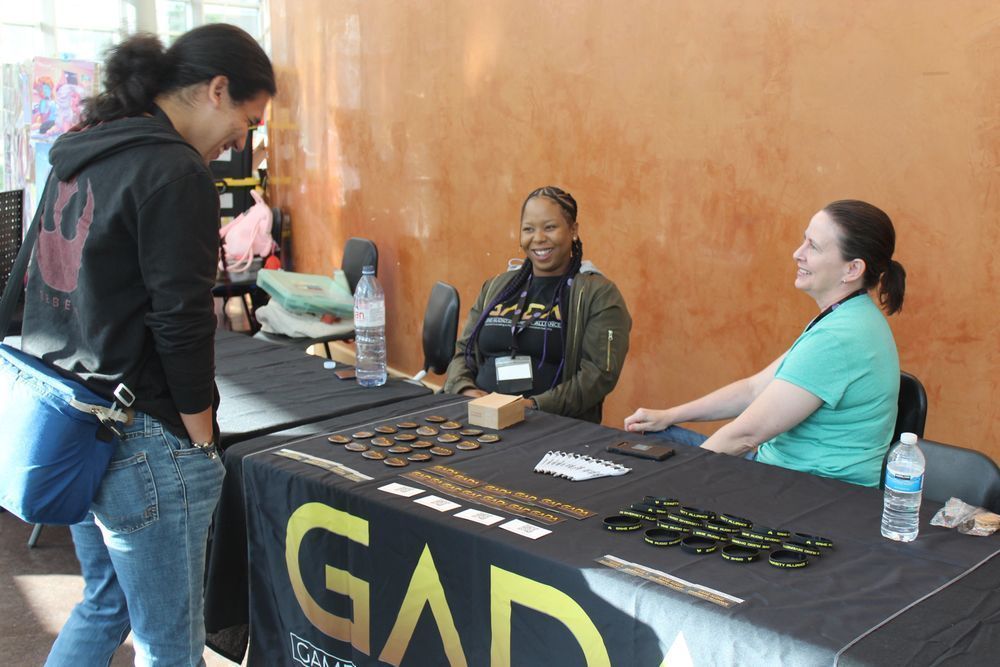 Conference attendees learn about GADA at our booth. 