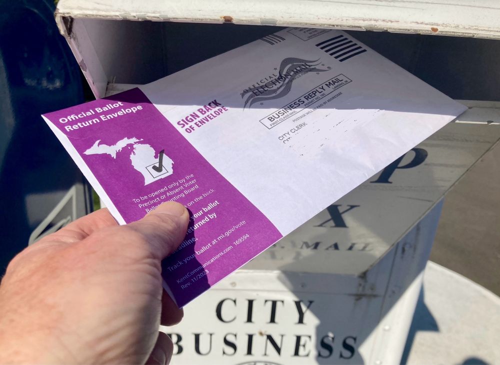 A general election ballot from Michigan is being inserted into a ballot box. I voted!!