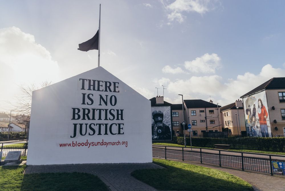 Free Derry Corner repainted to display "There Is No British Justice" with a black flag at half mast. 
Marking the Legacy Act being passed by British parliament to try and end investigation into murders carried out by the state in Northern Ireland.