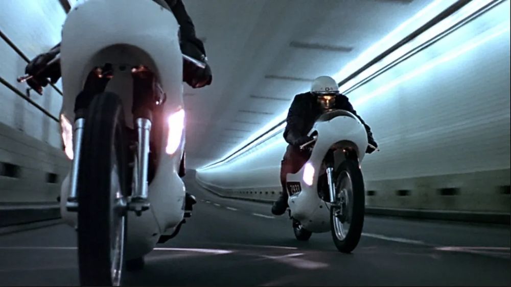 Still image. Two android police on motorbikes in tunnel.