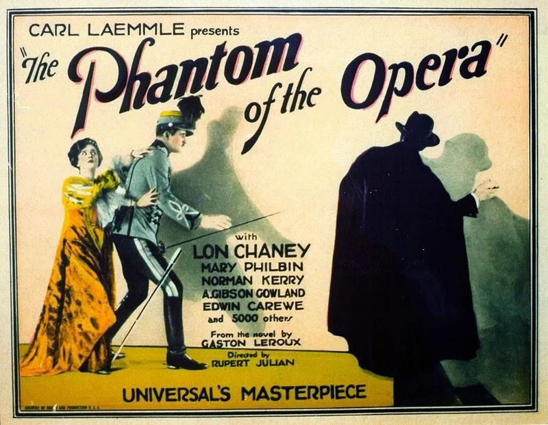 Film poster. Colour illustration. Norman Kerry and Mary Philbin  stand next to shadowy figure in cloak and hat.