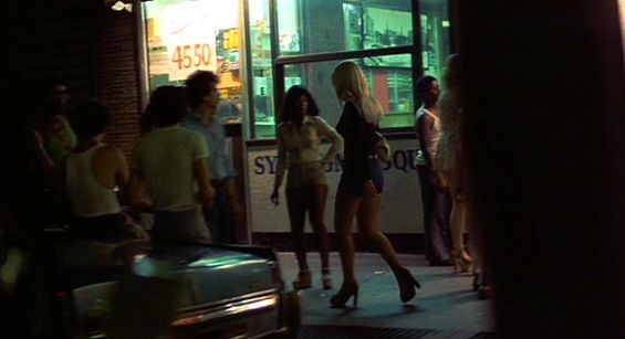 Still image. Times Square street scene at night.