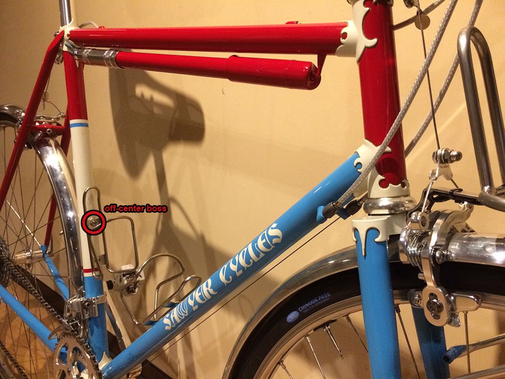 different angle of the bike with a red circle around the off-center water bottle boss