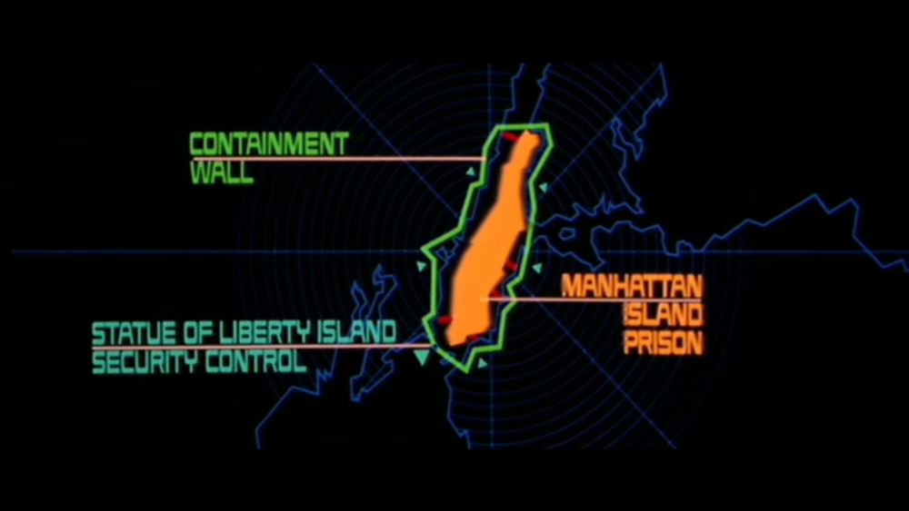 image from the opening of Escape From new York showing a map of Manhattan Island Prison, the containment wall, and Statue of Liberty Island Security Control