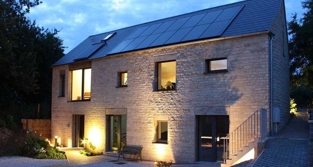 Exterior of a comfortable, ultra-low energy family home at night