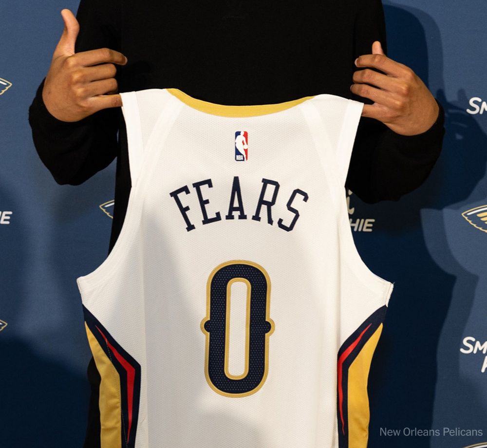fears holding up a 0 jersey