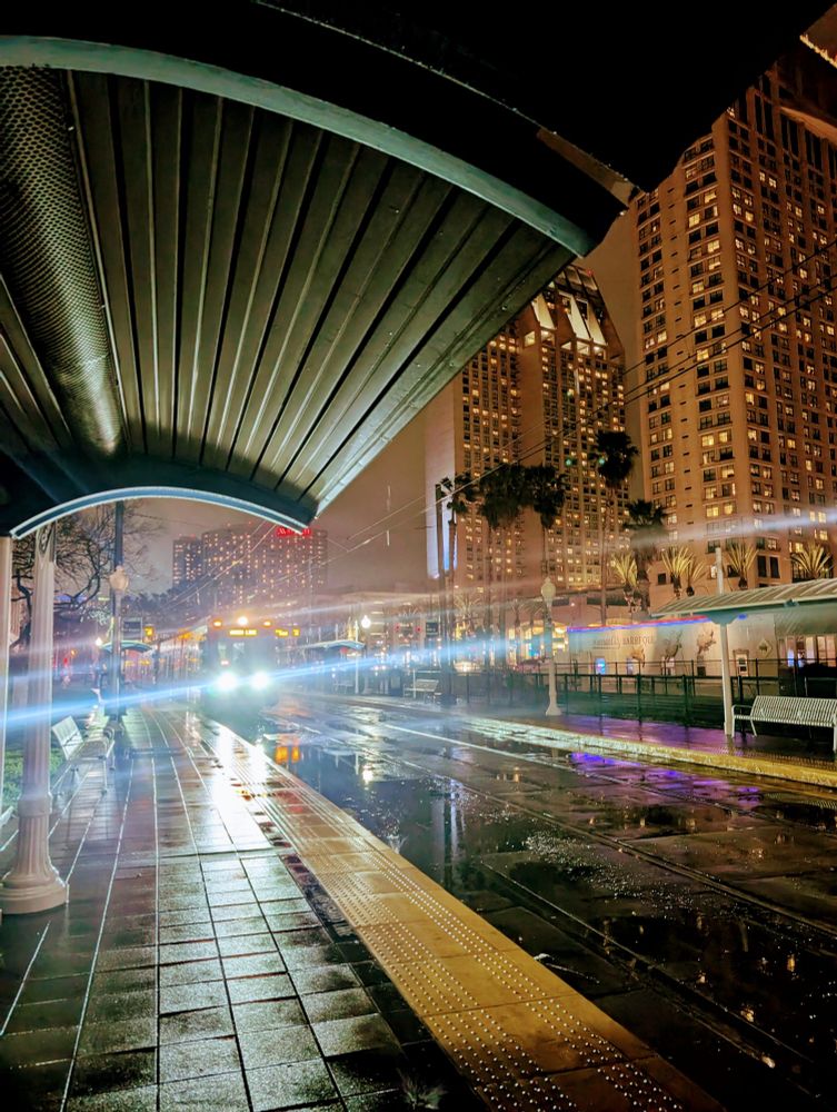 Trolley approaching seaport village station in San Diego at night