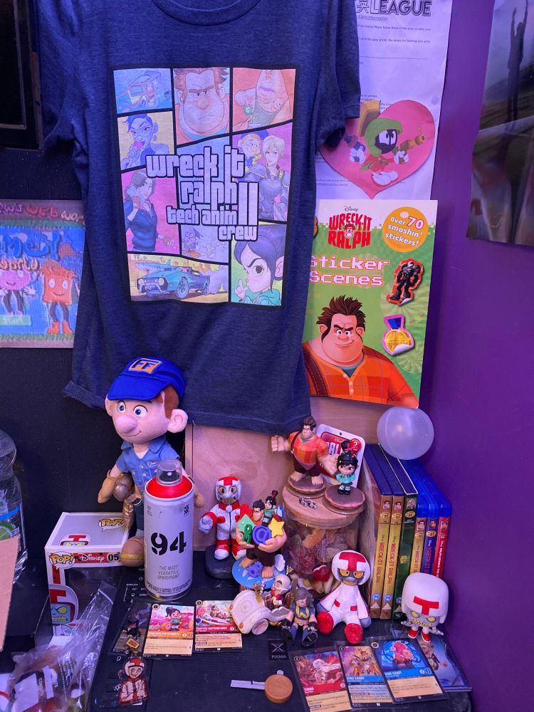 Wreck it Ralph merchandise. Two custom made turbo figure (one by me, other by my bestie), Turbo funko pop, 5 Disney lorcana cards of king candy, his cybug form, turbo, vanellope and taffyta in a watermelon variant, King candy Disney 100 card, Ralph and vanellope Disney infinity figures, Wreck it Ralph sticker book, Turbo acrylic charm from “IzukoShopART”, Wreck it ralph D-Stage figure, Two WIR dvds, One Disney villains varient of the WIR dvd, Two WIR Blue Ray Discs, One RBTI blue Ray disc, Fix-It Felix plushie, RBTI Crew member Shirt, Vanellope earring studs from “TinkImaginEars” on Etsy 