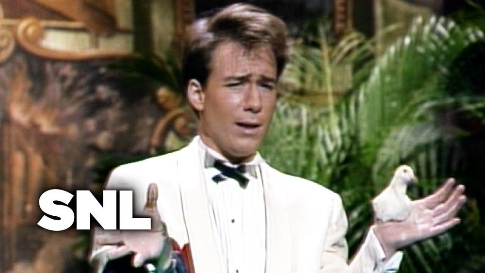 Joel Hodgson in a white tux in one of his performances on Saturday Night Live.