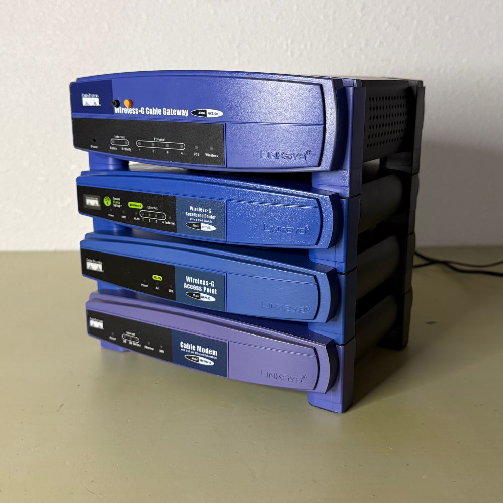 A stack of blue linksys router cases pictured from an angle