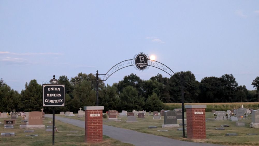 Full moon rising over the entrance to the union miners cemetery 
