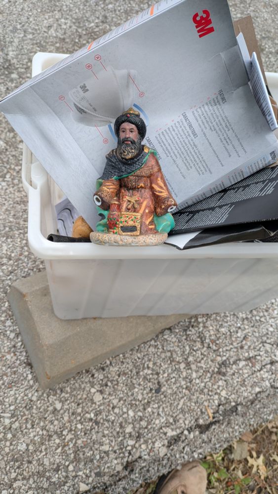 Broken Magi statue that is trash but somebody chose to donate