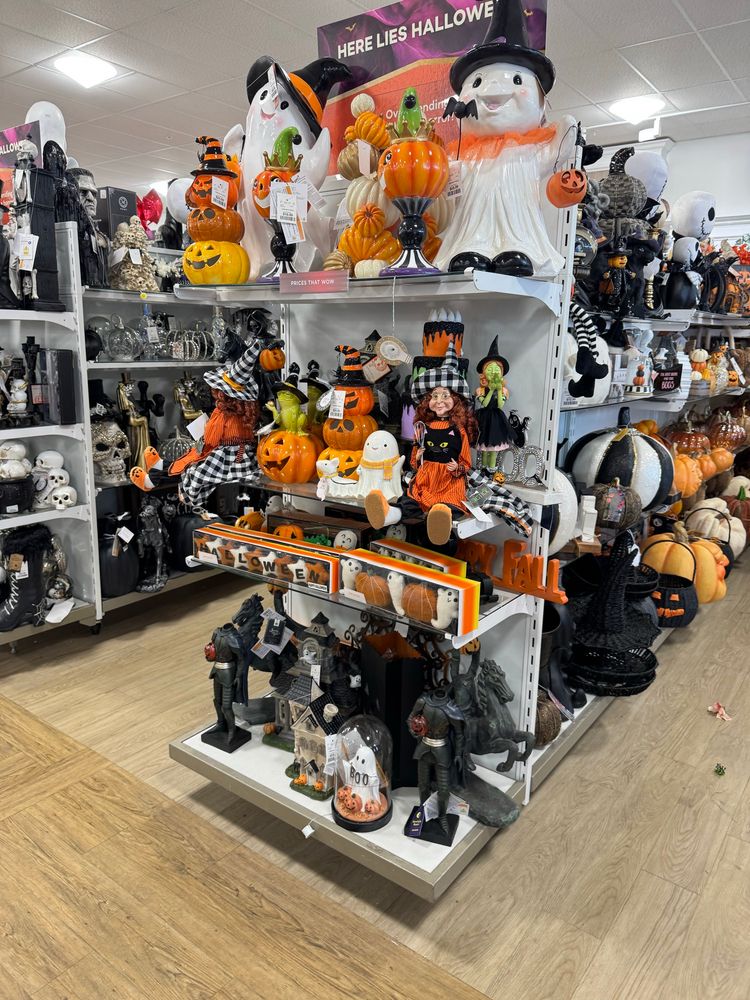 A photo of overly cutesy and schlocky Halloween decorations on a shelf ON JULY 27!!! Not okay!!!