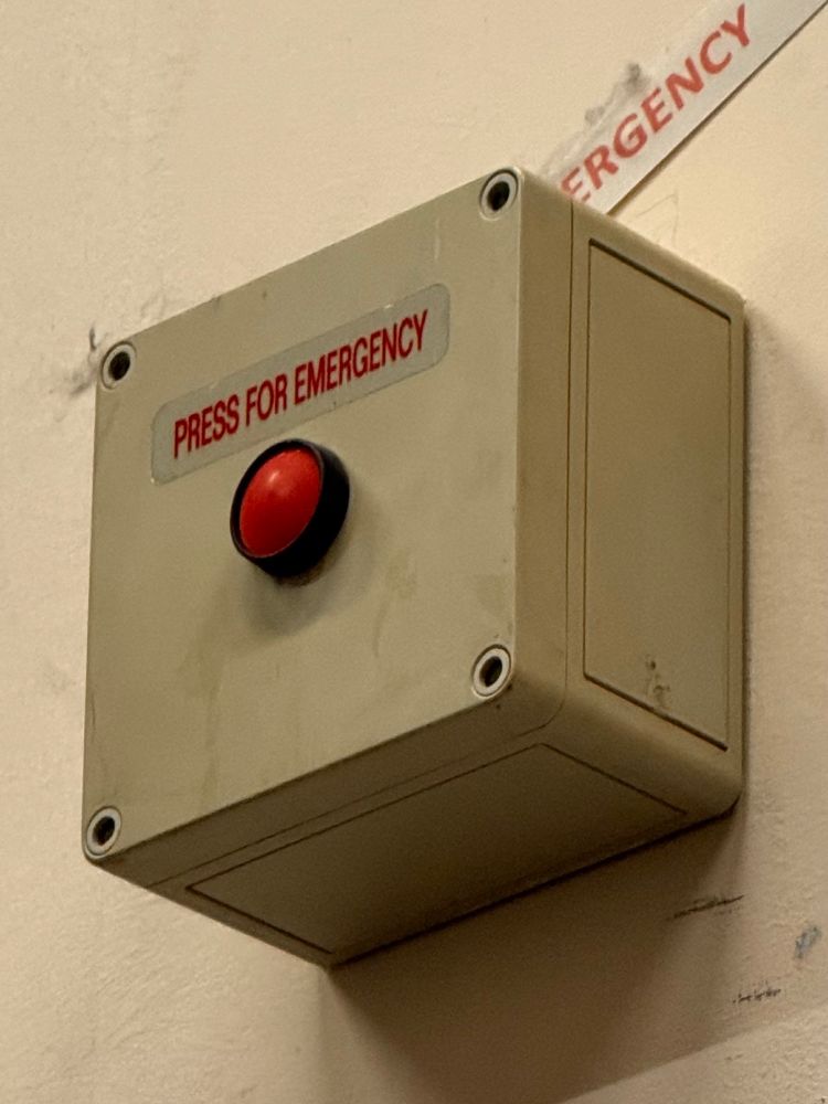 Red button labelled PRESS FOR EMERGENCY