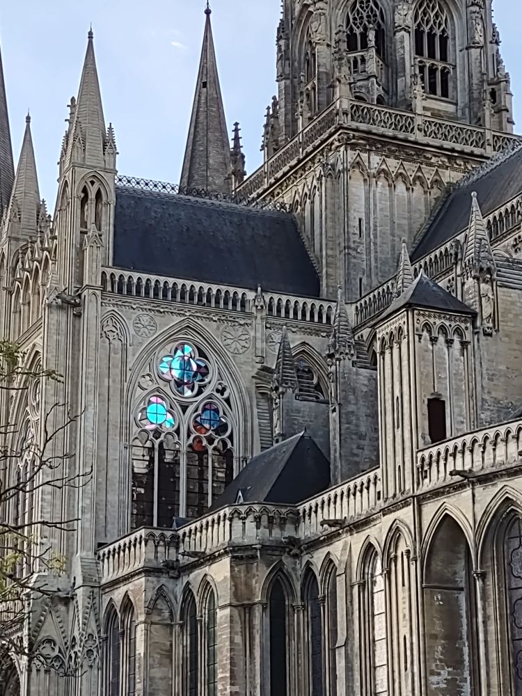 Evening sunlight shining through bright blue cathedral of Notre Dame Bayeux. 13th century French