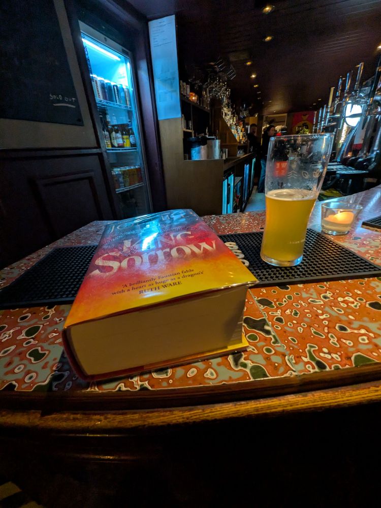 In a pub, reading king sorrow by Joe hill