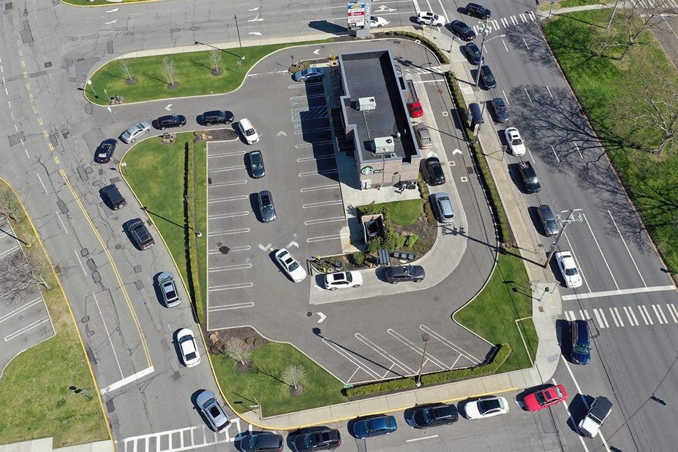 Cars lined up for a drive thru via Birds Eye view 