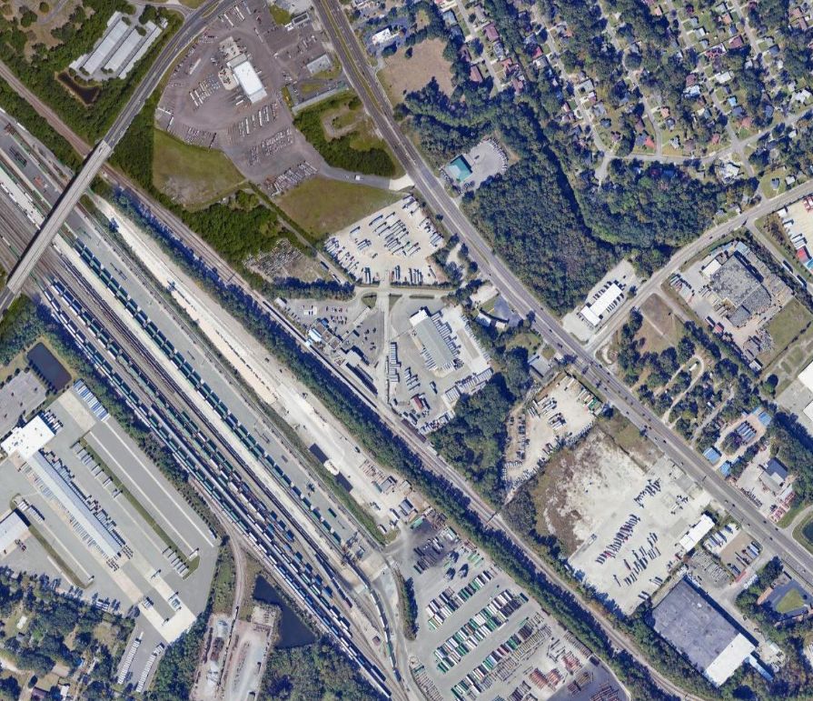 Aerial imagery of Jacksonville, TX Amtrak station surrounded by industrial land use