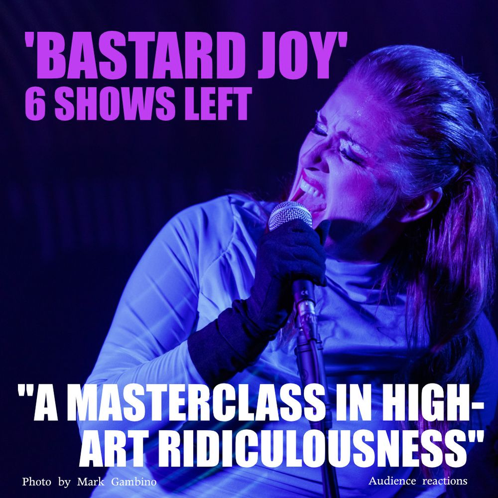 Redheaded woman in a blue wiggle dress and black gloves singing into a microphone with the text "A masterclass in high-art ridiculousness"