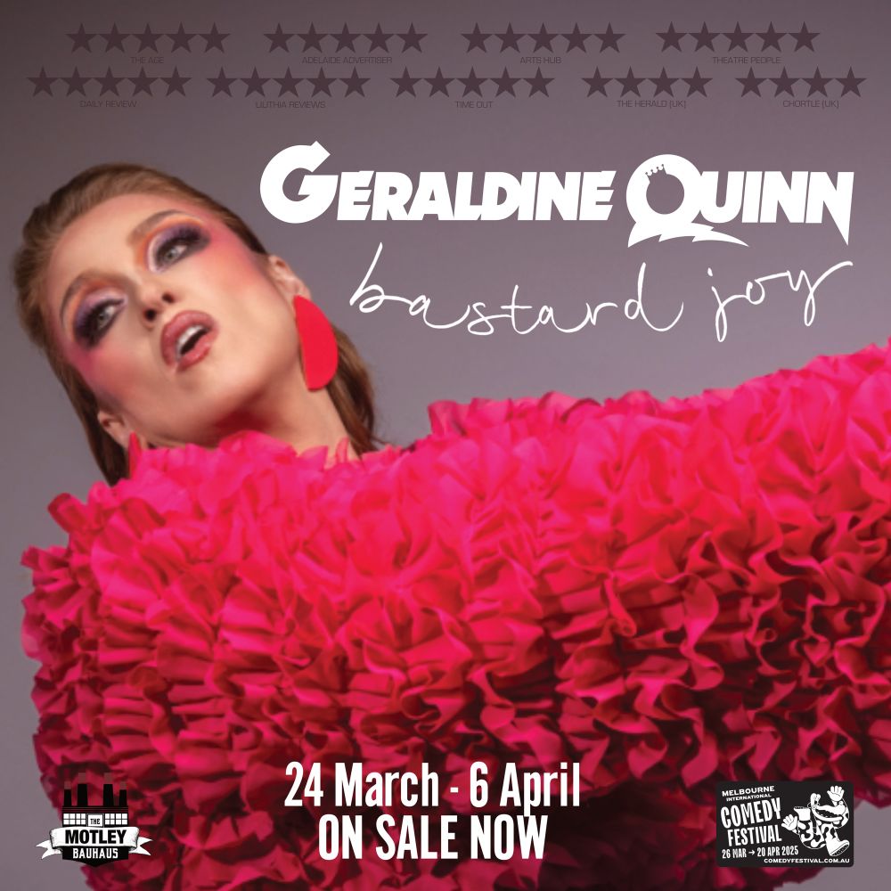 Redheaded woman in ruffled pink top and shocking pink geometric earrings posing artistically, gazing into middle distance arms outstretched. Very editorial. Very fashion. 