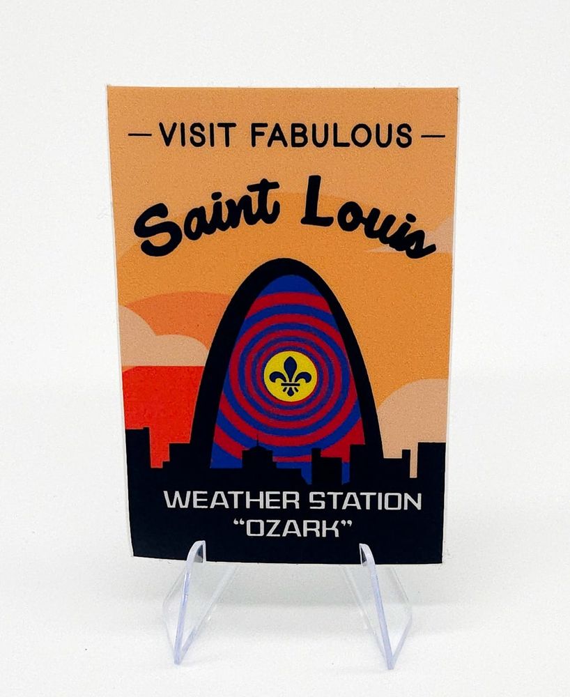 What a Hell of a Way to Die sticker that says Visit Fabulous St Louis - Weather Station Ozarks" with artwork of the Gateway Arch filled in with a psychedelic spiral & Fleur-de-lis 