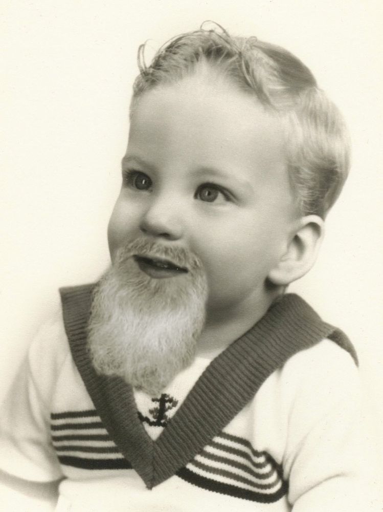 photo of bearded baby in sailor shirt