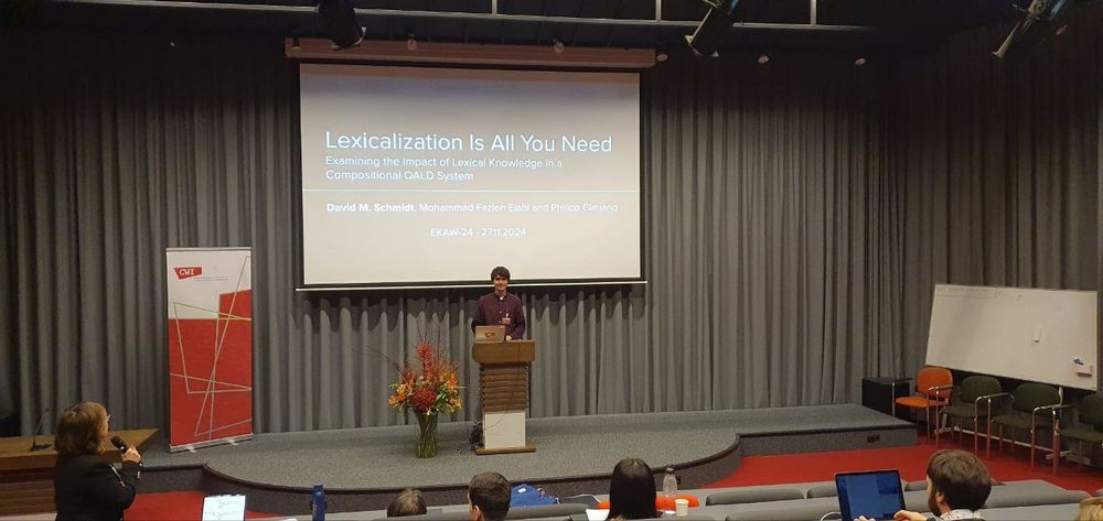David M. Schmidt giving a talk on the paper "Lexicalization Is All You Need: Examining the Impact of Lexical Knowledge in a Compositional QALD System" at the 24th International Conference on Knowledge Engineering and Knowledge Management in Amsterdam.