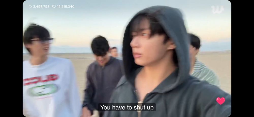 Blurry still from bts ot7 live with the caption “you have to shut up” 