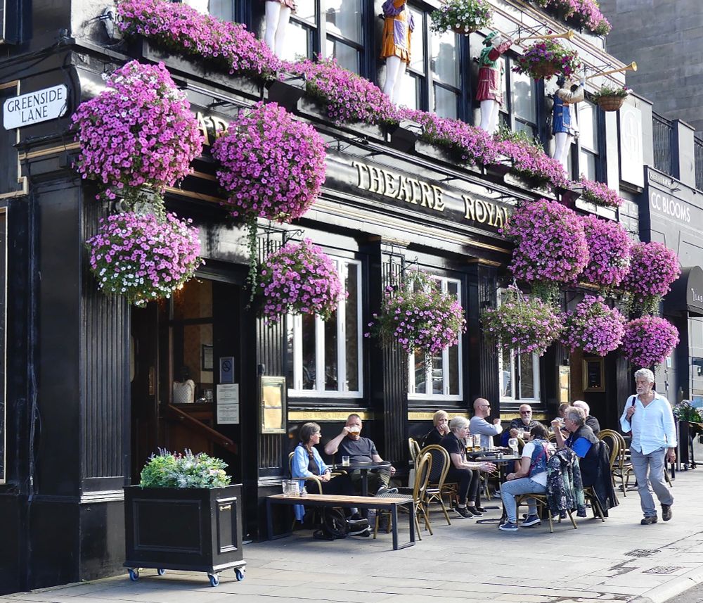 Floral displays in hanging baskets outside the Theatre Royal, Greenside Place, Edinburgh.