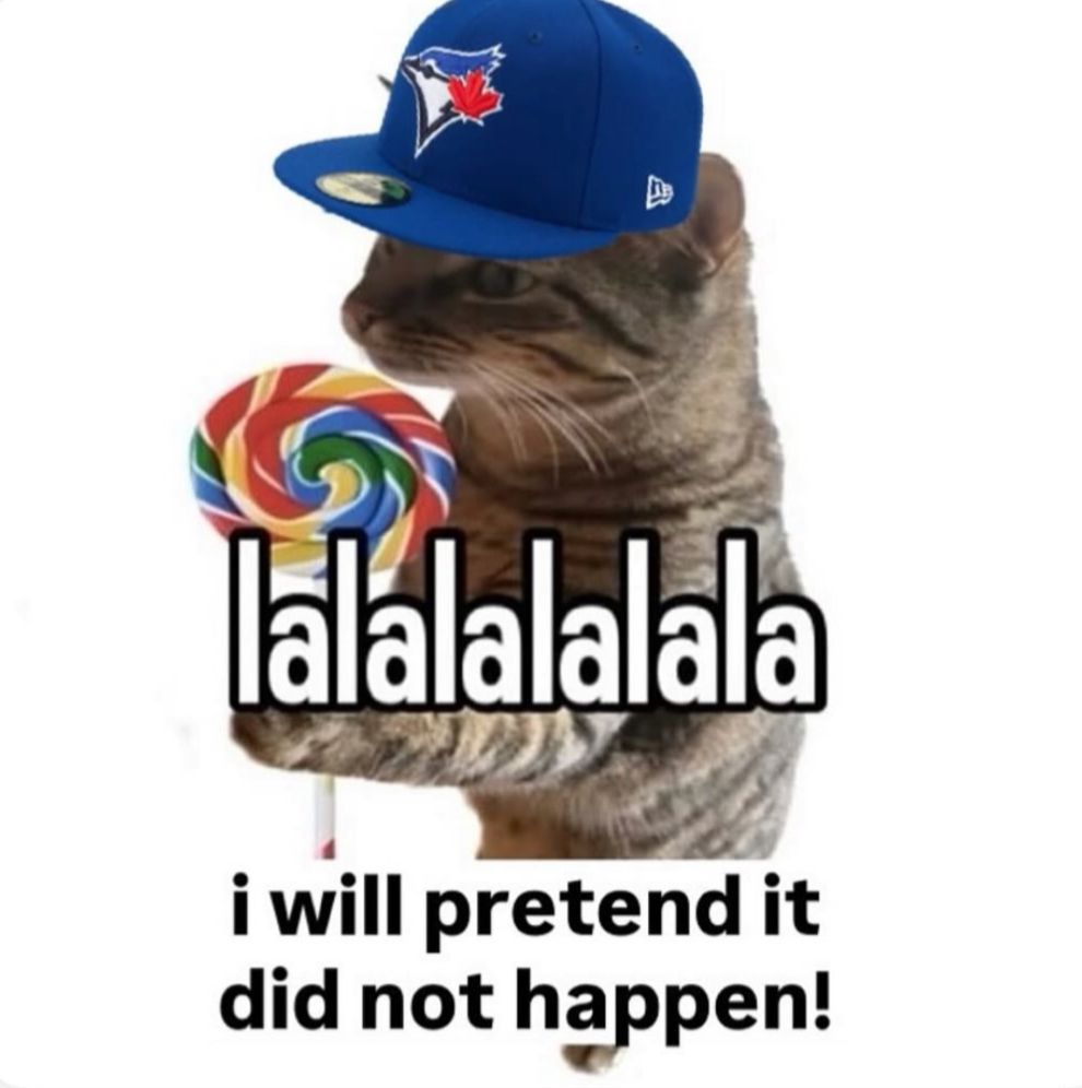 Meme of a cat wearing a Blue Jays hat and holding a lollipop saying "lalalalalala i will pretend it did not happen!"