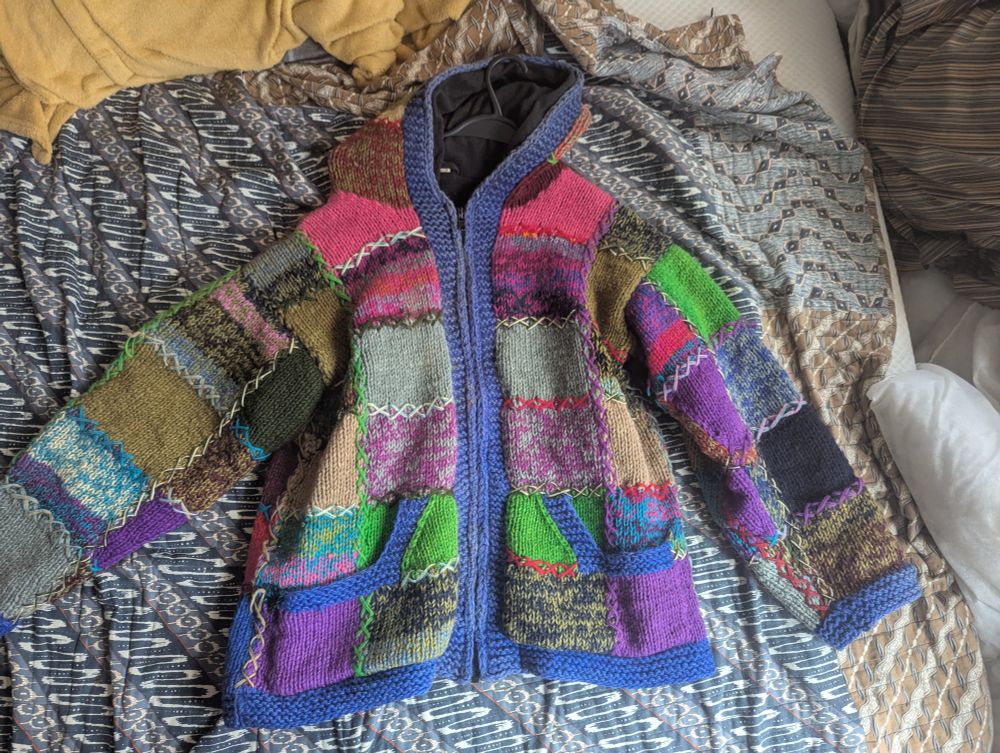Patchwork multicoloured knitted hoodie.