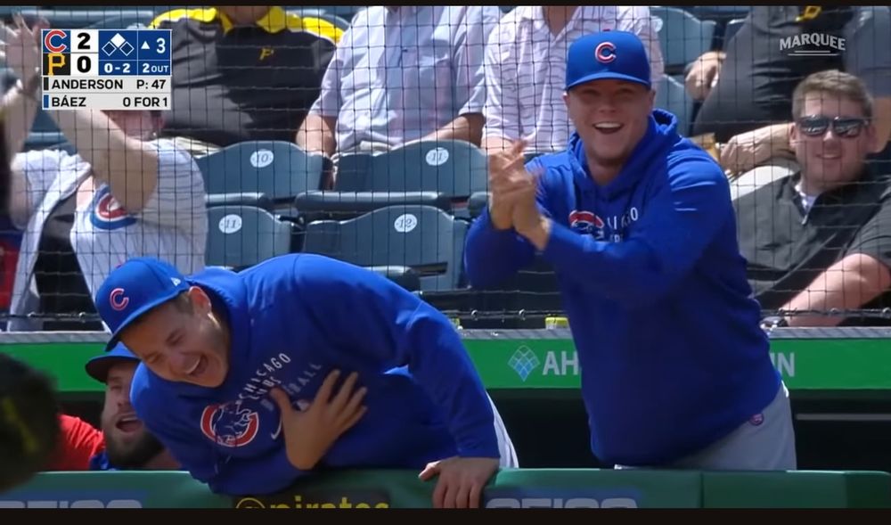 Anthony Rizzo cackling in the dugout after Javy Baez stole first and second base on a little league play
