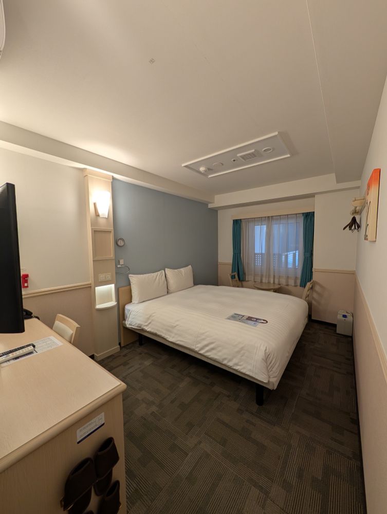 Toyoko Inn Budget Hotel bedroom with double bed. 